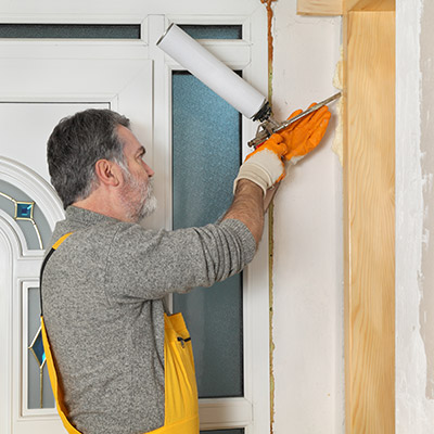 man installing door