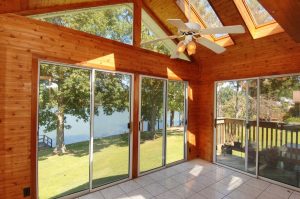 large sunroom overlooking lake