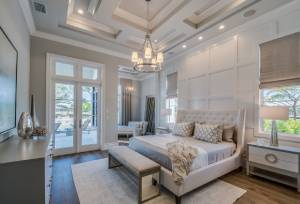 Luxury master bedroom with patio doors