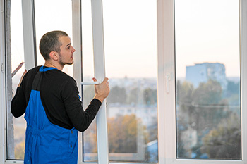 Technician installing a window